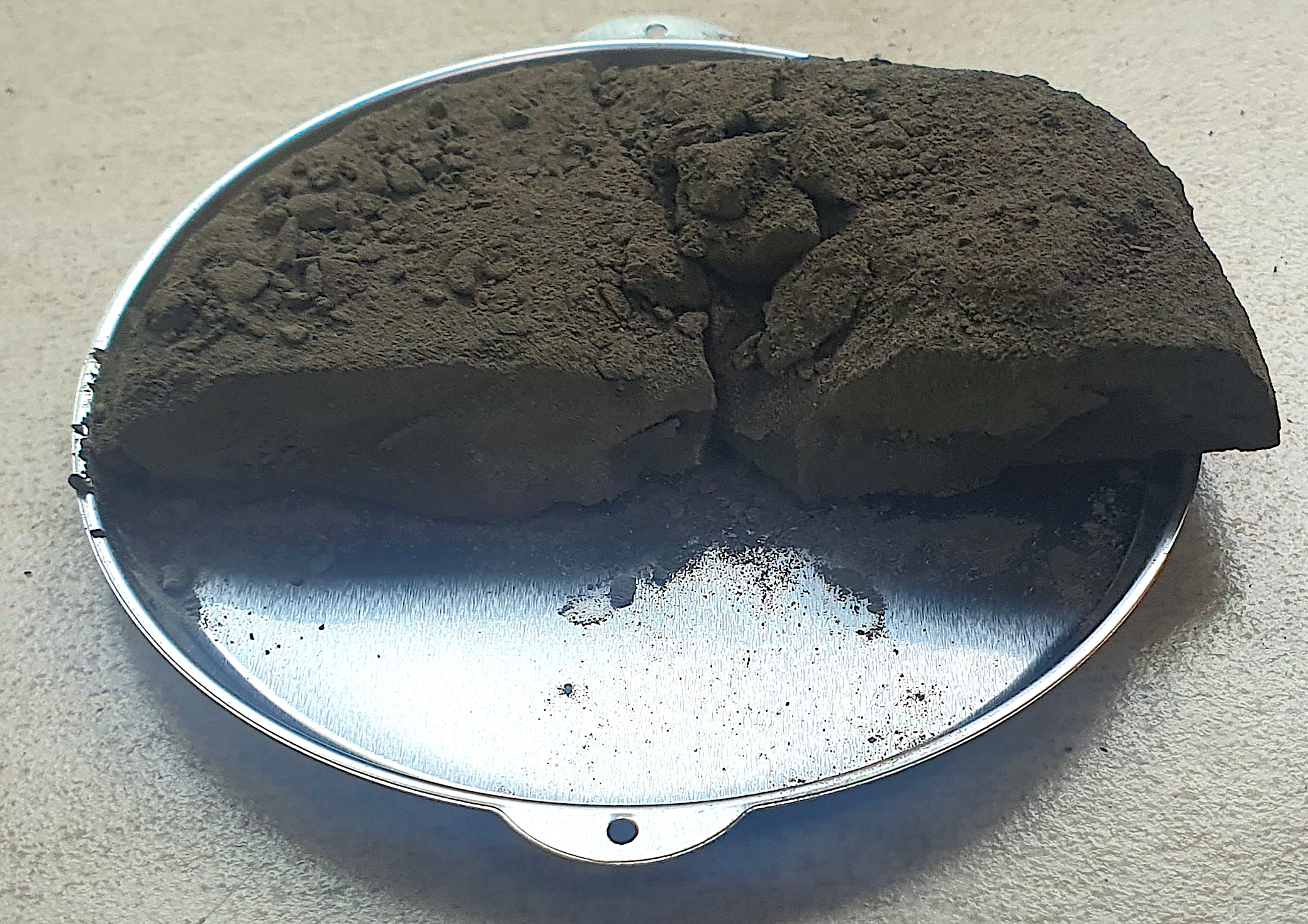 Dried filtration cake residue after completion of solid-liquid separation process.